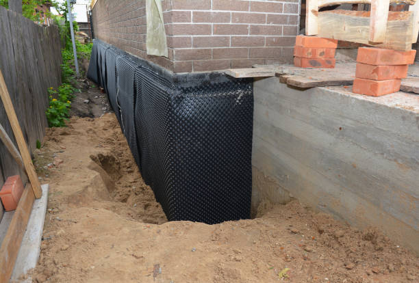SJ Waterproofing Pros technician performing targeted Exterior Waterproofing assessment in Coker, AL
